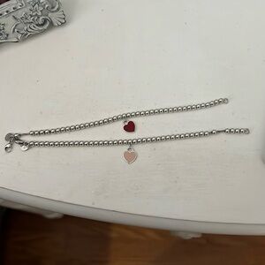 TWO Tiffany bracelets bundled together. Signature bracelet. Pink and red heart.
